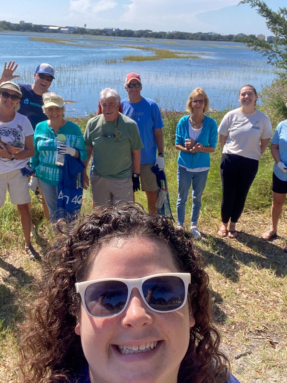 A group of Southeast Coastal Ambassadors pose with Coastal Education Coordinator Bonnie Mitchell during a 2023 NC King Tides Project training.